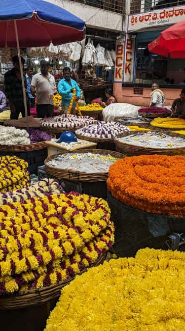 Bangalore Walking Tour KR Flower Market,Fort,Tippu palace - Flower stalls: colorful hands, fragrant stems, and vendor rhythms