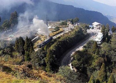 Darjeeling: Full-Day Guided Sightseeing Tour by Car - Entering the Darjeeling Rock Garden for calm views and waterfall sound