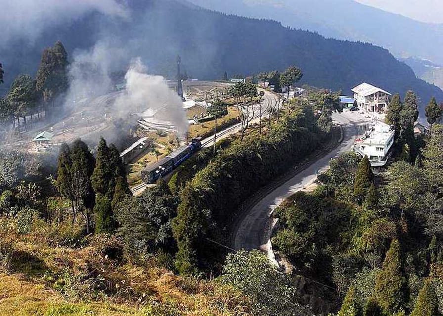 Darjeeling: Full-Day Guided Sightseeing Tour by Car - Entering the Darjeeling Rock Garden for calm views and waterfall sound