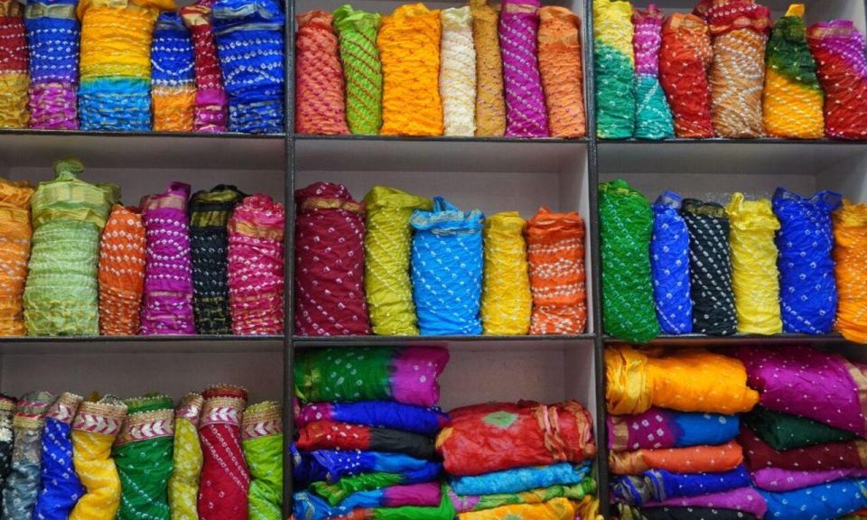 Delhi: Half day Shopping tour with guide by car. - The Art-and-Cottage Emporium Stop: Carpets, Pashmina, and Craft Souvenirs